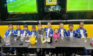 Blue and white team sat in a row