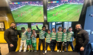 Canterbury Youth FC stood on chairs