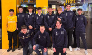 Dark blue team stood outside Wing Kingz