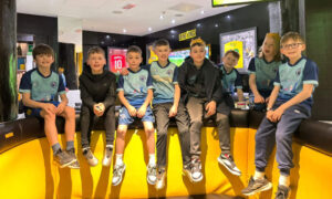 Team on top of chairs